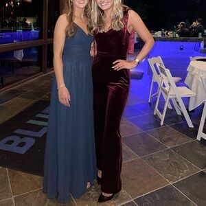 Maroon velvet jumpsuit with bow tie shoulders